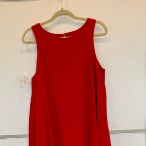 Like DKNY red sleeveless flawless asymmetrical dress.Size 12.PTP-20”.Excellent.